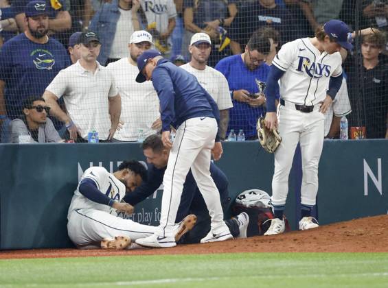 October 12, 2026, St. Petersburg, Florida, USA: Tampa Bay Rays third baseman Junior Caminero (13) is examined after colliding with Tampa Bay Rays right fielder Jonny DeLuca (21) while attempting to catch a foul ball during the ninth inning of Game 1 of the American League Championship Series between the Tampa Bay Rays and the gainst the Cleveland Guardians on Monday, Oct. 12, 2026, at Tropicana Field in St. Petersburg. St. Petersburg USA - ZUMAs70_ 0869264111st Copyright: xJeffereexWoox