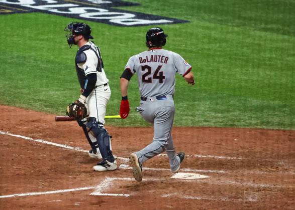 October 12, 2026, St. Pewtersburg, Florida, USA: Tampa Bay Rays catcher Liam Hicks (34) looks on as Cleveland Guardians right fielder Chase DeLauter (24) scores on a two run single hit by first baseman Nathaniel Lowe (46) in the eighth inning during the American League Championship Series game 1 at Tropicana Field on Monday, Oct. 12, 2026 in St. Petersburg. St. Pewtersburg USA - ZUMAs70_ 0869264484st Copyright: xDirkxShaddx