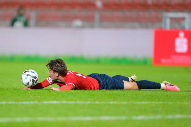 Samuel Weiss of Unterhaching, 17, is lying on the ground after a foul; free kick; single frame; action; 13 10 2026; Unterhaching, Germany; soccer; Bavarian Regional League; SpVgg Unterhaching vs. TSV 1882 Landsberg xslx