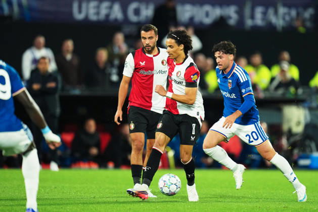 UEFA Champions League: Feyenoord Rotterdam v Como 1907 Rotterdam - Gjivai Zechiel of Feyenoord, Martin Baturina of Como during the MD 2 League Phase competition round of the 2026 2027 UEFA Champions League season. The match is set between Feyenoord Rotterdam and Como 1907 at Stadion Feijenoord on 14 October 2026 in Rotterdam, Netherlands. Copyright: xYannickxVerhoevenx