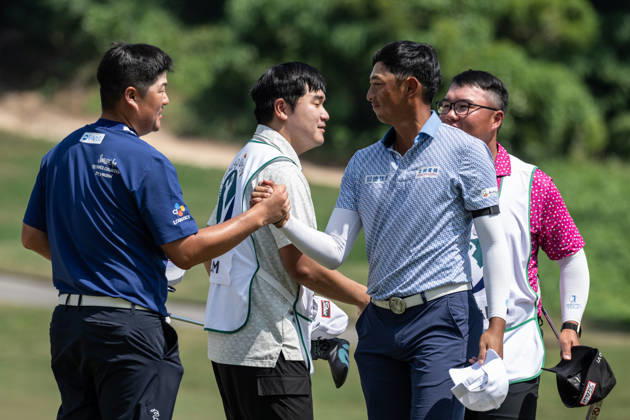 October 16, 2026, Coloane, Macao Sar, China: Sungjae IM from Korea (L) is congratulated on coming in -13 par by WANG Wei-hsuan from Taiwan(R) finishes -10par to rank 2nd.Round 2 in the Macao Open Golf at Macau Golf & Country Club. Coloane China - ZUMAr144 20261016_zap_r144_084 Copyright: xJaynexRussellx