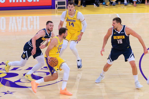 October 16, 2026, Los Angeles, California, USA: Luka Doncic 77 of the Los Angeles Lakers is defended by Nikola Jokic 15 and Christian Braun 0 of the Denver Nuggets battle for the ball during a preseason NBA, Basketball Herren, USA game on Friday, October 16, 2026, at Crypto.com Arena in Los Angeles, California. JAVIER ROJAS PI Lakers Vs. Nuggets - Preseason - ZUMAp124 20261016_zaa_p124_009 Copyright: xJavierxRojasx