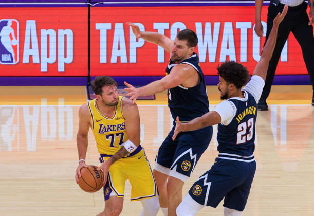 October 16, 2026, Los Angeles, California, USA: Luka Doncic 77 of the Los Angeles Lakers is guarded by Nikola Jokic 15 and Cameron Johnson 23 of the Denver Nuggets during a preseason NBA, Basketball Herren, USA game on Friday, October 16, 2026, at Crypto.com Arena in Los Angeles, California. JAVIER ROJAS PI Lakers Vs. Nuggets - Preseason - ZUMAp124 20261016_zaa_p124_012 Copyright: xJavierxRojasx
