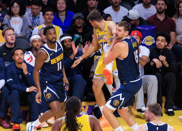 October 16, 2026, Los Angeles, California, USA: Luka Doncic 77 of the Los Angeles Lakers falls out of bounds as Nikola Jokic 15 of the Denver Nuggets defends during a preseason NBA, Basketball Herren, USA game on Friday, October 16, 2026, at Crypto.com Arena in Los Angeles, California. JAVIER ROJAS PI Lakers Vs. Nuggets - Preseason - ZUMAp124 20261016_zaa_p124_019 Copyright: xJavierxRojasx