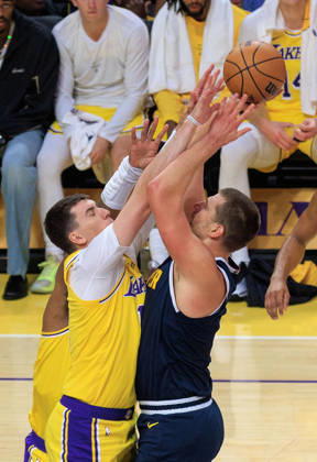 October 16, 2026, Los Angeles, California, USA: Jake LaRavia 12 of the Los Angeles Lakers blocks a shot by Nikola Jokic 15 of the Denver Nuggets during a preseason NBA, Basketball Herren, USA game on Friday October 16, 2026 at Crypto.com Arena in Los Angeles, California. Lakers lose to Nuggets, 106-121. JAVIER ROJAS PI Lakers Vs. Nuggets - Preseason  - ZUMAp124 20261016_zaa_p124_052 Copyright: xJavierxRojasx