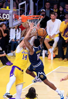 October 16, 2026, Los Angeles, California, USA: Walker Kessler 14 of the Los Angeles Lakers tries to block a layup by Alpha Diallo 11 of the Denver Nuggets during a preseason NBA, Basketball Herren, USA game on Friday October 16, 2026 at Crypto.com Arena in Los Angeles, California. Lakers lose to Nuggets, 106-121. JAVIER ROJAS PI Lakers Vs. Nuggets - Preseason  - ZUMAp124 20261016_zaa_p124_054 Copyright: xJavierxRojasx