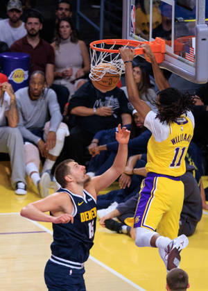 October 16, 2026, Los Angeles, California, USA: Ziaire Williams 11 of the Los Angeles Lakers dunks the ball over Nikola Jokic 15 of the Denver Nuggets during a preseason NBA, Basketball Herren, USA game on Friday October 16, 2026 at Crypto.com Arena in Los Angeles, California. Lakers lose to Nuggets, 106-121. JAVIER ROJAS PI Lakers Vs. Nuggets - Preseason  - ZUMAp124 20261016_zaa_p124_056 Copyright: xJavierxRojasx