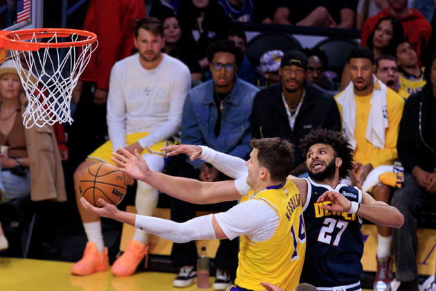 October 16, 2026, Los Angeles, California, USA: Walker Kessler 14 of the Los Angeles Lakers is defended by Jamal Murray 27 of the Denver Nuggets during a preseason NBA, Basketball Herren, USA game on Friday October 16, 2026 at Crypto.com Arena in Los Angeles, California. Lakers lose to Nuggets, 106-121. JAVIER ROJAS PI Lakers Vs. Nuggets - Preseason  - ZUMAp124 20261016_zaa_p124_057 Copyright: xJavierxRojasx