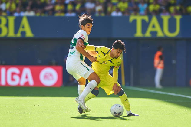 Gonzalo Villar of Elche CF and Ilias Akhomach of Villarreal CF during the LaLiga EA Sports match between Villarreal CF and Elche CF at Estadio de la Cerámica on October 17, 2026, in Villarreal, Spain