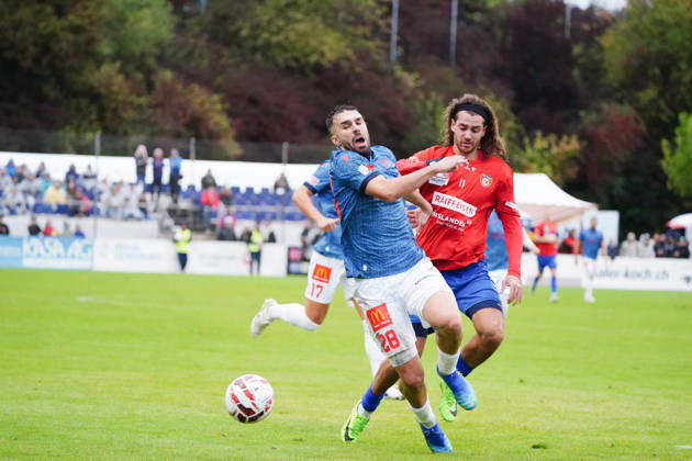 October 17, 2026, Cham, Switzerland; Men s Soccer, 2026–2027 Season, Swiss Cup, Round 2, SC Cham vs. FC Sion, 0–2; Photo: Hajrizi Kreshnik, FC Sion vs. Marin Wiskemann, SC Cham; Reaction to a tackle