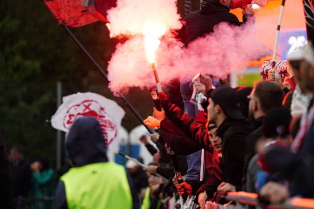 October 26, 2017, Cham, Switzerland, Men s Soccer, 2026–2027 Season, Swiss Cup, Round 2, SC Cham vs. FC Sion, 0–2. Photo: FC Sion away fans setting off pyrotechnics and Bengal flares. Fan culture.