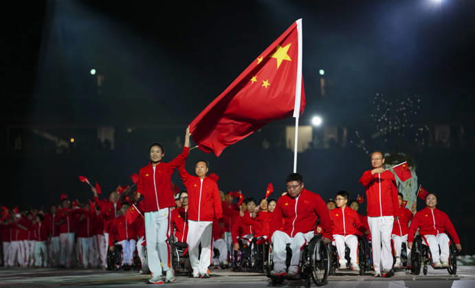 (261018) -- NAGOYA, Oct. 18, 2026 -- The delegation of China parades into the stadium during the opening ceremony of the Aichi-Nagoya Asian Para Games in Nagoya, Japan, Oct. 18, 2026. ) (SP)JAPAN-NAGOYA-ASIAN PARA GAMES-OPENING CEREMONY JiaxHaocheng 