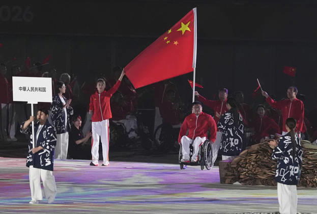 (261018) -- NAGOYA, Oct. 18, 2026 -- Flag bearers of China Li Yujie and Yan Panpan parade into the stadium during the opening ceremony of the Aichi-Nagoya Asian Para Games in Nagoya, Japan, Oct. 18, 2026. ) (SP)JAPAN-NAGOYA-ASIAN PARA GAMES-OPENING CEREMONY CaixYang 