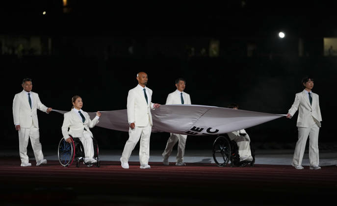 (261018) -- NAGOYA, Oct. 18, 2026 -- The flag of the Asian Paralympic Committee is carried during the opening ceremony of the Aichi-Nagoya Asian Para Games in Nagoya, Japan, Oct. 18, 2026. ) (SP)JAPAN-NAGOYA-ASIAN PARA GAMES-OPENING CEREMONY JiaxHaocheng 