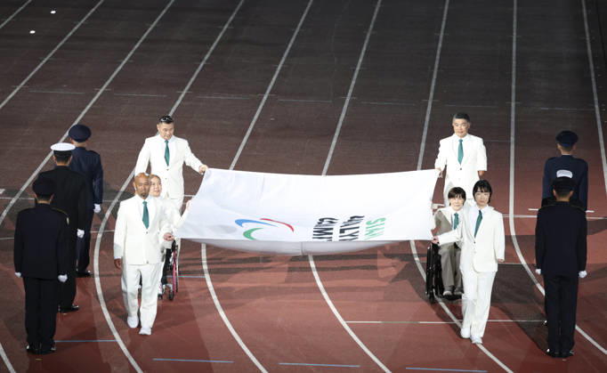 (261018) -- NAGOYA, Oct. 18, 2026 -- The flag of the Asian Paralympic Committee is carried during the opening ceremony of the Aichi-Nagoya Asian Para Games in Nagoya, Japan, Oct. 18, 2026. ) (SP)JAPAN-NAGOYA-ASIAN PARA GAMES-OPENING CEREMONY YaoxQilin 