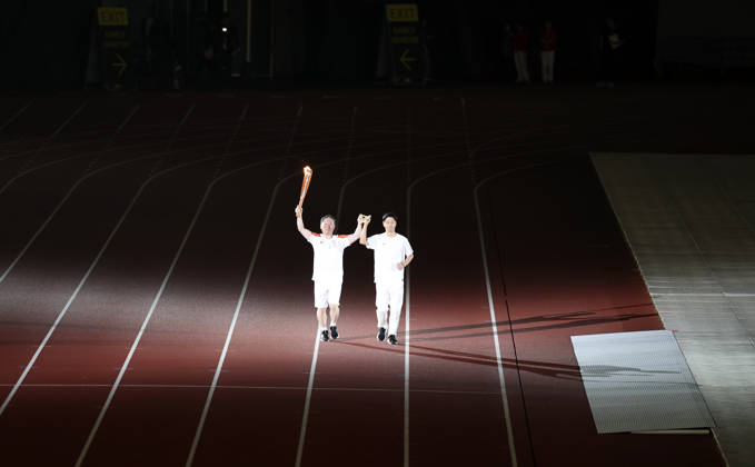 (261018) -- NAGOYA, Oct. 18, 2026 -- Torch bearers relay the torch during the opening ceremony of the Aichi-Nagoya Asian Para Games in Nagoya, Japan, Oct. 18, 2026. ) (SP)JAPAN-NAGOYA-ASIAN PARA GAMES-OPENING CEREMONY YaoxQilin 