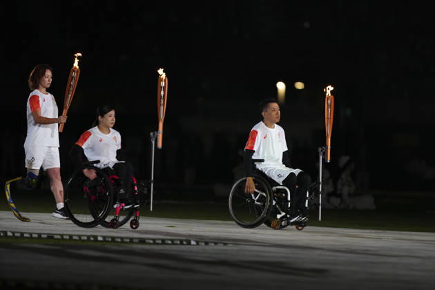 (261018) -- NAGOYA, Oct. 18, 2026 -- Torch bearers relay the torch during the opening ceremony of the Aichi-Nagoya Asian Para Games in Nagoya, Japan, Oct. 18, 2026. ) (SP)JAPAN-NAGOYA-ASIAN PARA GAMES-OPENING CEREMONY JiaxHaocheng 