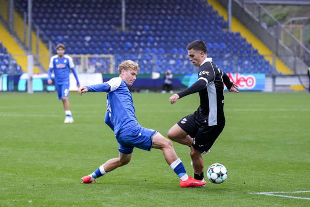 From left: Krystof Cizek (TSG II), 26; Almin Mesanovic (Verl), 30; tackle in front of empty stands; game scene; duel; tackle; tackling; dynamic; action; few spectators; October 18, 2026, Sinsheim, Germany, soccer, 3rd Division, TSG 1899 Hoffenheim II vs. SC Verl, DFB and DFL regulations prohibit any use of photographs as image sequences and or quasi-video xozx