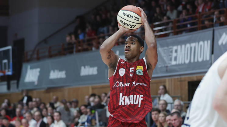 Pictured: Kenny Dye of the Würzburg Baskets, No. 5, making a three-pointer on October 18, 2026, Fitness First Würzburg Baskets vs. SYNTAINICS MBC, Netto BBL Cup, Round of 16, Germany, 97072, tectake Arena Würzburg, Copyright: HMBxMedia xJulienxBecker