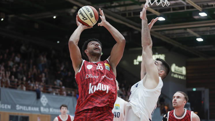Pictured from left: Marvin Ogunsipe of Würzburg Baskets, No. 26, making a layup against Jure Planinic of Syntainics MBC, No. 44 (18 10 2026), Fitness First Würzburg Baskets vs. SYNTAINICS MBC, Netto BBL Cup, Round of 16, Germany, 97072, tectake Arena Würzburg, Copyright: HMBxMedia xJulienxBecker