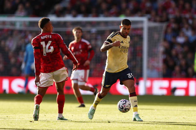 Nottingham, England, 18th October 2026. Bruno Guimaraes of Arsenal with the ball under pressure from Dan Ndoye of Nottingham Forest during the Nottingham Forest vs Arsenal Premier League match at the City Ground, Nottingham. Picture credit should read: Jake Youle Sportimage EDITORIAL USE ONLY. No use with unauthorised audio, video, data, fixture lists, club league logos or live services. Online in-match use limited to 120 images, no video emulation. No use in betting, games or single club league player publications. SPI_022_JY_Forest_Arsenal SPI-5083-0022