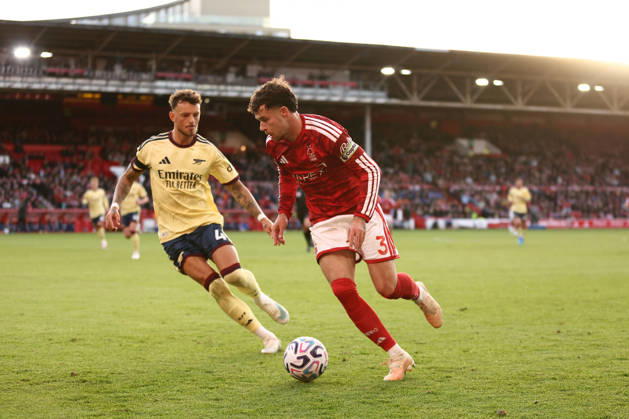 Nottingham, England, 18th October 2026. Ben White of Arsenal and Neco Williams of Nottingham Forest challenge for the ball during the Nottingham Forest vs Arsenal Premier League match at the City Ground, Nottingham. Picture credit should read: Jake Youle Sportimage EDITORIAL USE ONLY. No use with unauthorised audio, video, data, fixture lists, club league logos or live services. Online in-match use limited to 120 images, no video emulation. No use in betting, games or single club league player publications. SPI_027_JY_Forest_Arsenal SPI-5083-0027