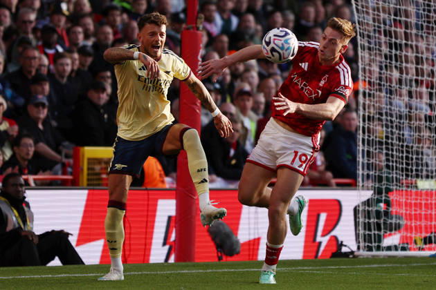 Nottingham, England, 18th October 2026. Ben White of Arsenal and Liam Delap of Nottingham Forest challenge for the ball during the Nottingham Forest vs Arsenal Premier League match at the City Ground, Nottingham. Picture credit should read: Jake Youle Sportimage EDITORIAL USE ONLY. No use with unauthorised audio, video, data, fixture lists, club league logos or live services. Online in-match use limited to 120 images, no video emulation. No use in betting, games or single club league player publications. SPI_028_JY_Forest_Arsenal SPI-5083-0028