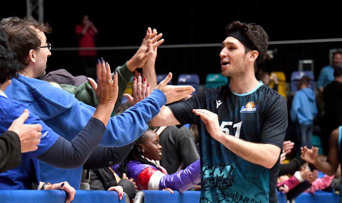 October 18, 2026, xokbx, BBL Basketball Cup, Frankfurt Skyliners vs. VET Concept Gladiators Trier; Ryan Arcidiacono of the Fraport Skyliners Frankfurt celebrates and cheers the victory with the fans, high-fiving them in Frankfurt am Main