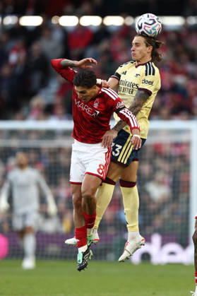 Nottingham, England, 18th October 2026. Nicolas Dominguez of Nottingham Forest and Riccardo Calafiori of Arsenal challenge for the ball during the Nottingham Forest vs Arsenal Premier League match at the City Ground, Nottingham. Picture credit should read: Jake Youle Sportimage EDITORIAL USE ONLY. No use with unauthorised audio, video, data, fixture lists, club league logos or live services. Online in-match use limited to 120 images, no video emulation. No use in betting, games or single club league player publications. SPI_029_JY_Forest_Arsenal SPI-5083-0029