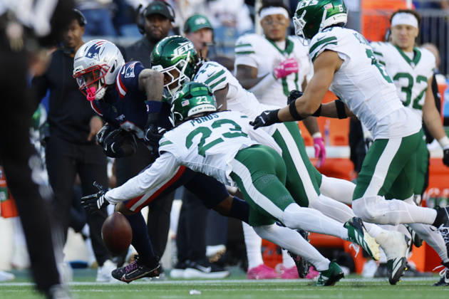 New England Patriots wide receiver DeMario Douglas, left, fumbles the ball during the second half against the New York Jets at Gillette Stadium in Foxborough, Massachusetts on Sunday, October 18, 2026. BOP20261018015 CJxGUNTHER