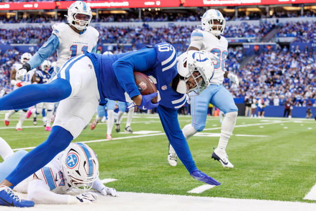 October 18, 2026, Indianapolis, Indiana, U.S: Indianapolis Colts wide receiver Keenan Allen (10) is knocked out at the six yard line by Tennessee Titans defensive back Marcus Harris (26) during the game between the Tennessee Titans and the Indianapolis Colts at Lucas Oil Stadium, Indianapolis, Indiana. Indianapolis U.S - ZUMAs304 20261018_zaf_s304_010 Copyright: xScottxStuartx
