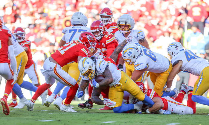 Oct 18, 2026: Los Angeles Chargers running back Omarion Hampton (8) gets tackled by Chiefs players in Kansas City, MO, USA; at Arrowhead Stadium. Mandatory Credit: -Cal Media Kansas City USA - ZUMAc04_ 20261018_zma_c04_231 Copyright: xRomanxPunox