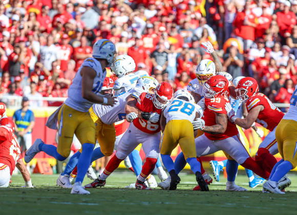 Oct 18, 2026: Los Angeles Chargers running back Kimani Vidal (28) runs through the defense and was tackled by Kansas City Chiefs defensive end George Karlaftis (56) and Kansas City Chiefs defensive lineman Peter Woods (99) in Kansas City, MO, USA; at Arrowhead Stadium. Mandatory Credit: -Cal Media NFL, American Football Herren, USA 2026: Chargers Vs Chiefs OCT 18  - ZUMAc04_ 20261018_zma_c04_246 Copyright: xRomanxPunox