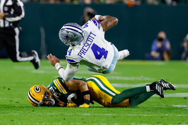 Oct 18, 2026; Green Bay, WI, USA; Dallas Cowboys quarterback Dak Prescott (4) is tackled by Green Bay Packers safety Evan Williams (33) during the NFL, American Football Herren, USA game at Lambeau Field. Mandatory Credit: -Cal Media. NFL 2026: Cowboys Vs Packers OCT 18  - ZUMAc04_ 20261018_zma_c04_489 Copyright: xDarrenxLeex