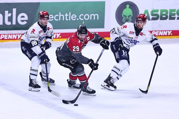 Tim Fleischer of the Cologne Haie, No. 29, in a one-on-one battle with Kyle Platzer of the Schwenningen Wild Wings, No. 88, on the left, and Thomas Schemitsch of the Schwenningen Wild Wings, No. 62 (GER), Cologne Sharks vs. Schwenningen Wild Wings, ice hockey, Penny DEL, Matchday 49, 2026–2027 season, October 20, 2026, Germany, Cologne Sharks vs. Schwenningen Wild Wings, ice hockey, Penny DEL, Matchday 49, 2026–2027 season, October 20, 2026, Cologne Copyright: xEibner-Pressefoto RenexWeissx EP_RWS