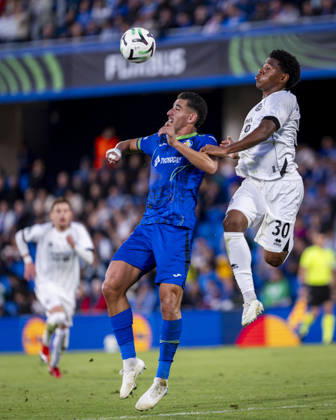 Getafe CF v FC Lugano - UEFA Conference League 2026 27 League Phase MD2 GETAFE, SPAIN - OCTOBER 22: Dereck Moncada of FC Lugano (R) heads the ball against Abdel Abqar of Getafe CF (L) during the UEFA Conference League 2026 27 League Phase MD2 match between Getafe CF and FC Lugano at Estadio Coliseum on October 22, 2026 in Getafe, Spain. Madrid Estadio Coliseum Madrid Spain Copyright: xAlbertoxGardinx AGardin_20261022_Get_Lug_0141