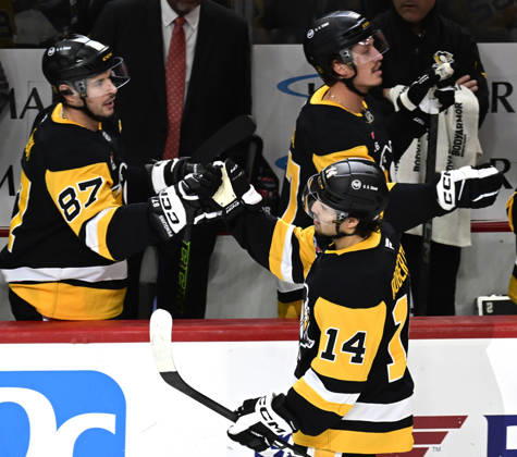 Pittsburgh Penguins left wing Nick Robertson (14) celebrates his empty net goal with Pittsburgh Penguins center Sidney Crosby (87) during the third period of the Pens 4-0 win against the Florida Panthers at PPG Paints Arena in Pittsburgh on Thursday, October 22, 2026.  PIT2026102213 ARCHIExCARPENTER