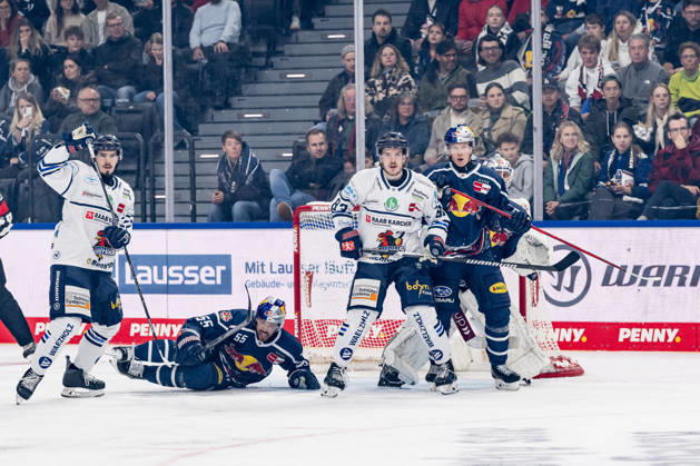 Fabio Wagner (EHC Red Bull Munich, 55) and Elis Hede (EHC Red Bull Munich, 10) defend against Daniel Neumann (Iserlohn Roosters, 22) and Kevin Bicker (Iserlohn Roosters, 83) in front of goalie Mathias Niederberger’s net, EHC Red Bull Munich, 35 GER, EHC Red Bull Munich vs. Iserlohn Roosters, DEL, 2026–2027 season, Matchday 11, October 23, 2026. Photo: HMB Media, Franz Feiner Copyright: HMBxMedia FranzxFeiner