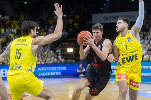 Oldenburg, Lower Saxony, Germany, October 23, 2026, Richard Balint (center), BMA365 Bamberg Baskets; Stefan Momirov (right), EWE Baskets Oldenburg; and Marcel Keßen (left), EWE Baskets Oldenburg. EWE Baskets Oldenburg vs. BMA365 Bamberg Baskets. Basketball 1. Basketball Bundesliga, 2026–2027 season, Matchday 6, Grosse EWE Arena: EWE Baskets Oldenburg vs. BMA365 Bamberg Baskets www.andreas-burmann.de