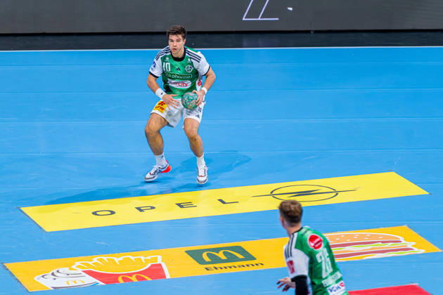 Renars Uscins of TSV Hannover Burgdorf, No. 10 from the left, TSV Hannover Burgdorf (green) vs. TBV Lemgo Lippe (blue) on Matchday 10 of the 2026–2027 season in the Opel Handball Bundesliga, October 23, 2026, ZAG Arena Hannover, GER, Copyright: xJanxGuentherx xTSVxHannover-Burgdorfx