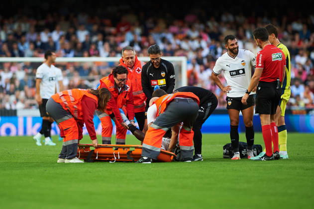 David Otorbi of Valencia CF is injured during the LaLiga EA Sports match between Valencia CF and Villarreal CF at Mestalla on October 24, 2026, in Valencia, Spain