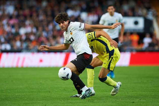 Carlos Macia of Villarreal CF and Javi Guerra of Valencia CF during the LaLiga EA Sports match between Valencia CF and Villarreal CF at Mestalla on October 24, 2026, in Valencia, Spain
