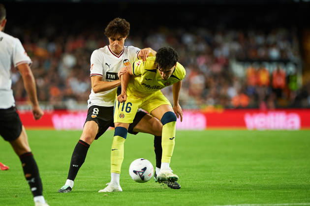 Carlos Macia of Villarreal CF and Javi Guerra of Valencia CF during the LaLiga EA Sports match between Valencia CF and Villarreal CF at Mestalla on October 24, 2026, in Valencia, Spain
