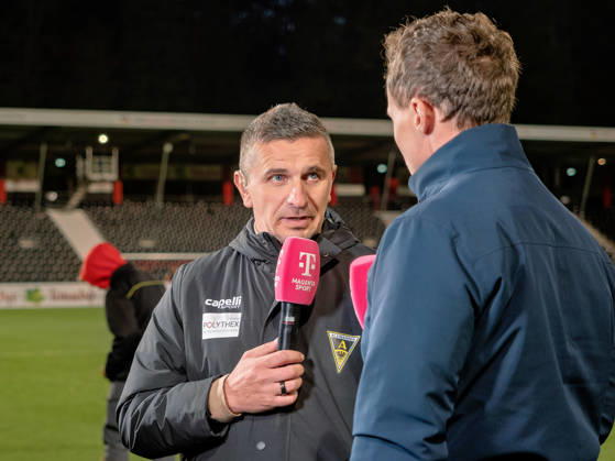 Post-game interview: Coach Mersad Selimbegovic of TSV Alemannia Aachen at the microphone; statement on the sponsor board; post-game report; gestures; GER, soccer, VfB Stuttgart II vs. Alemannia Aachen, 3rd Division, Matchday 11, Aspach, 2026–2027 season, October 24, 2026 GER, soccer, VfB Stuttgart II vs. Alemannia Aachen, 3rd Division, Matchday 11, Aspach, 2026–2027 season, October 24, 2026 Aspach Copyright: xCarstenxSchweringx EP_CSG