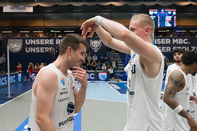 Spencer Reaves MBC, 31, and Collin Welp MBC, 40, celebrate the 103–98 overtime home victory: Syntainics MBC vs. Rostock Seawolves, BBL, Men’s Basketball 1st Bundesliga, Matchday 6 of the 2026–27 season, October 24, 2026, Weißenfels Stadthalle, Saxony-Anhalt, Germany