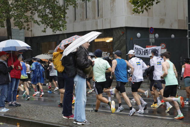 October 25, 2026 Track and Field 43 Mainova Frankfurt Marathon in the Rain Spectators with Umbrellas Frankfurt, Main, Hesse, Germany
