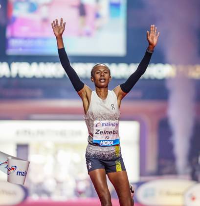 Ethiopian Zeineba Yimer Wins the Mainova Frankfurt Marathon in 2:19:45:25:10:26—A Triumphant Finish at the Festhalle. Zeineba Yimer of Ethiopia wins the women’s race at the Mainova Frankfurt Marathon with a winning time of 2:19:45 hours Frankfurt Festhalle Hesse Germany JRW02160