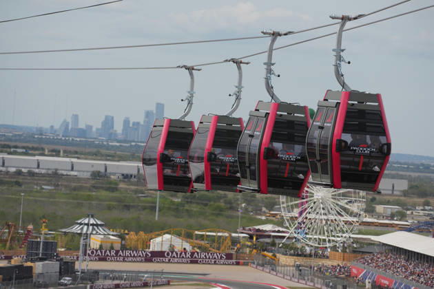 October 25, 2026, Circuit of The Americas, Austin, 2026 FORMULA 1 MSC CRUISES UNITED STATES GRAND PRIX, Shuttles travel back and forth between the main building in the paddock and the new station at the first turn, with the Austin skyline in the background. Photo by Hasan Bratic, DeFodi Images