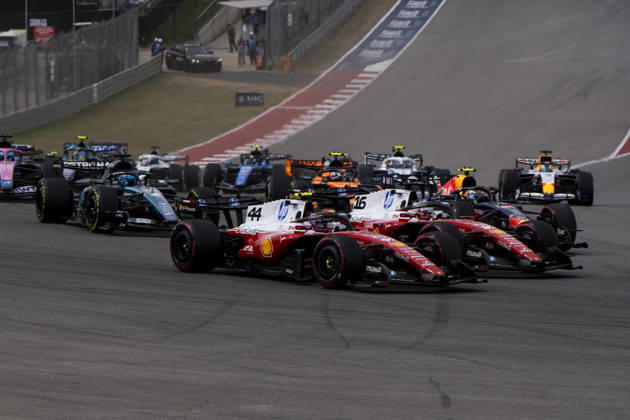 Monaco s Formula One driver Charles Leclerc of Scuderia Ferrari and British Formula One driver Lewis Hamilton of Scuderia Ferrari battle on lap one of the Formula One United States Grand Prix at the Circuit of the Americas in Austin, Texas on Sunday, October 25, 2026.  AUS2026102563 GREGxNASH