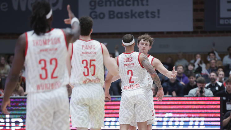 Pictured: Celebrating, from left: Charles Thompson (Wuerzburg Baskets, 32), Alen Pjanic (Wuerzburg Baskets, 35), Max Jones (Wuerzburg Baskets, 2), and Calvin Wishart (Wuerzburg Baskets, 10) on October 26, 2026,Fitness First Würzburg Baskets vs. NINERS Chemnitz, easyCredit BBL, Matchday 6, Germany, 97072, tectake Arena Würzburg, Copyright: HMBxMedia xJulienxBecker